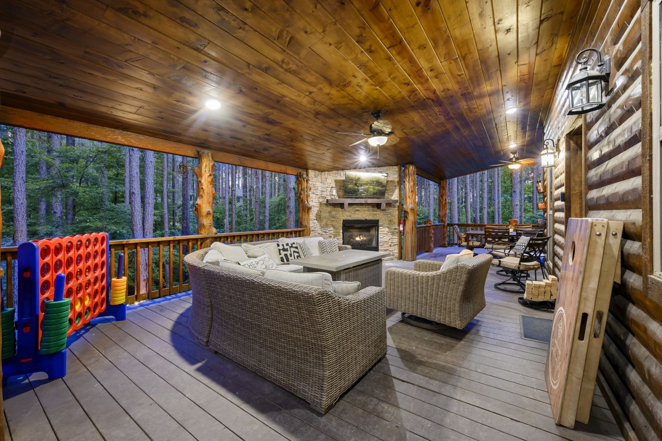 Your own private outdoor resort awaits u2014 fireplace, dining, yard games, and forest as far as you can see.
