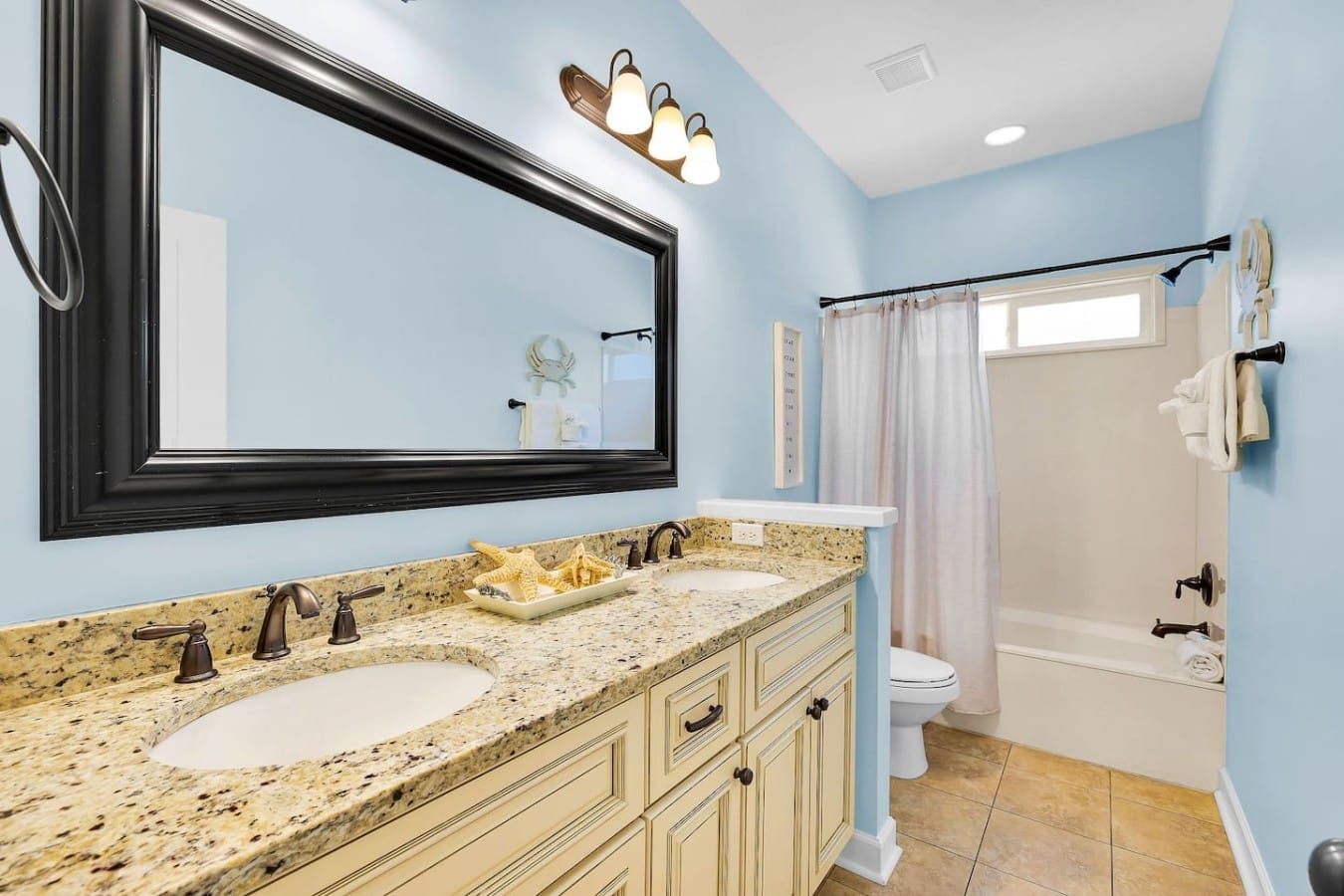 A double vanity and tub combo means everyone gets ready on vacation time, not a schedule.