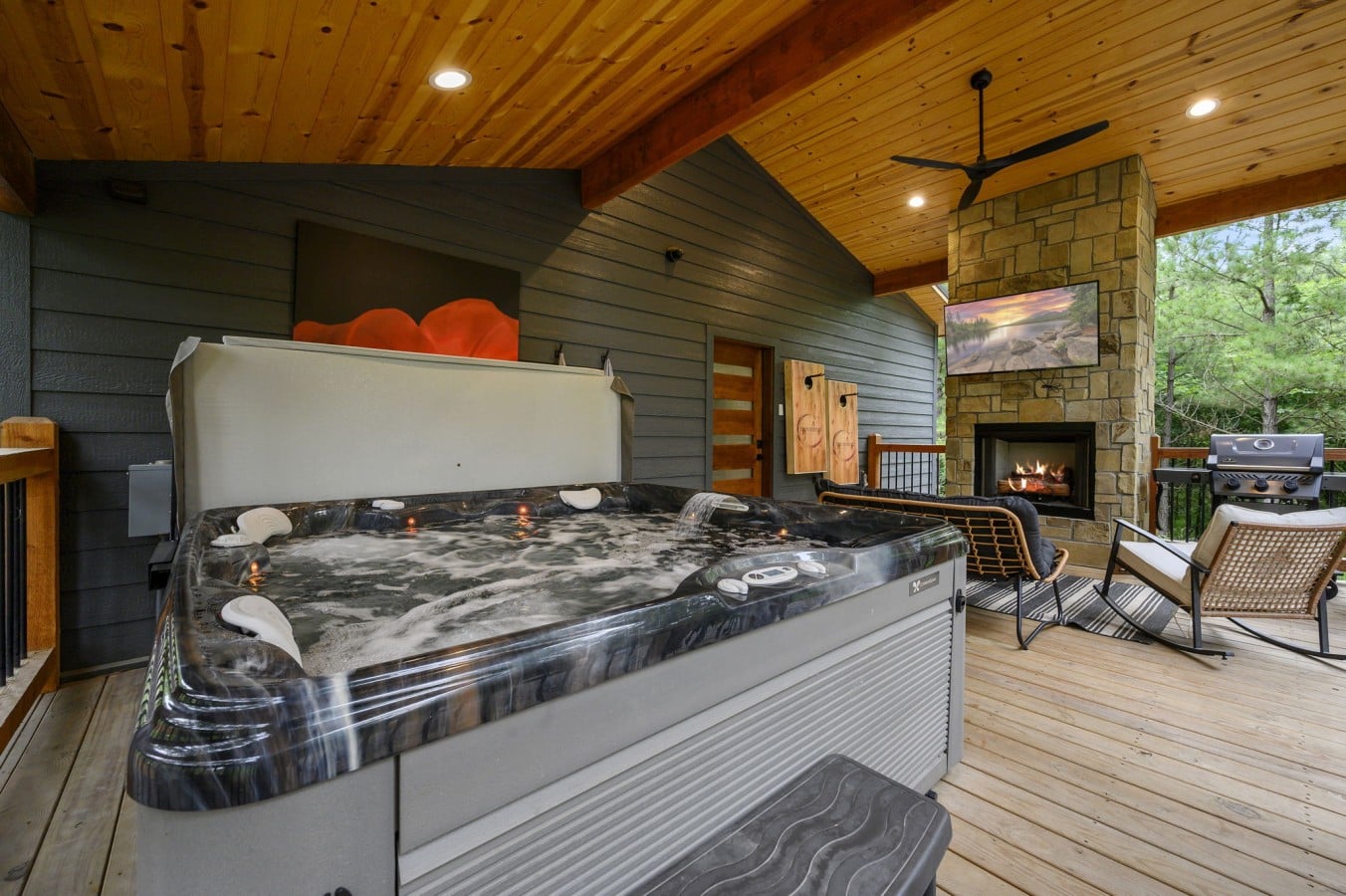 Soak in the hot tub beside a crackling fire while the game plays overhead.