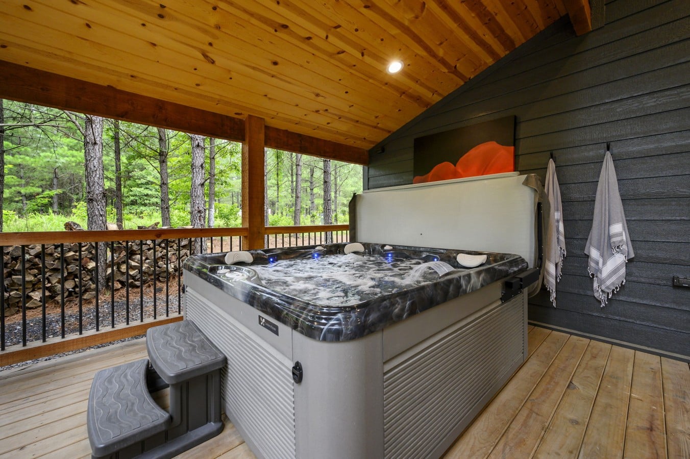 Slip into the glowing hot tub after dark, with the pine forest all around you.