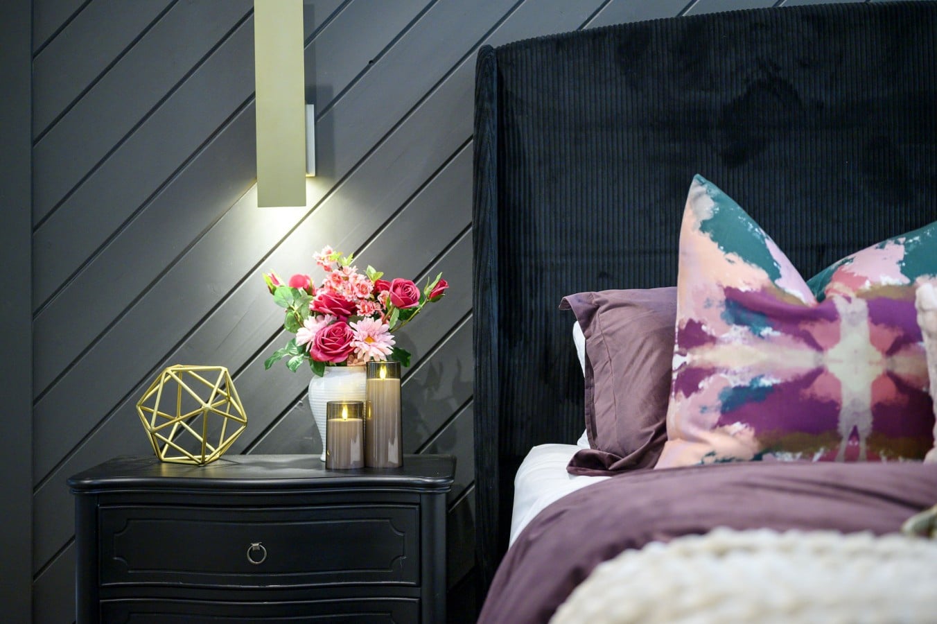 Candlelight, fresh flowers, and moody shiplap walls make every night feel special.