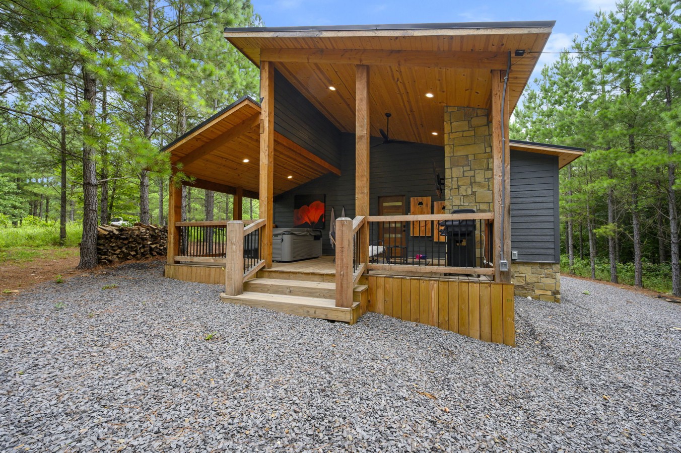 Hot tub, ceiling fan, and a grill — the back deck has everything for a perfect night.