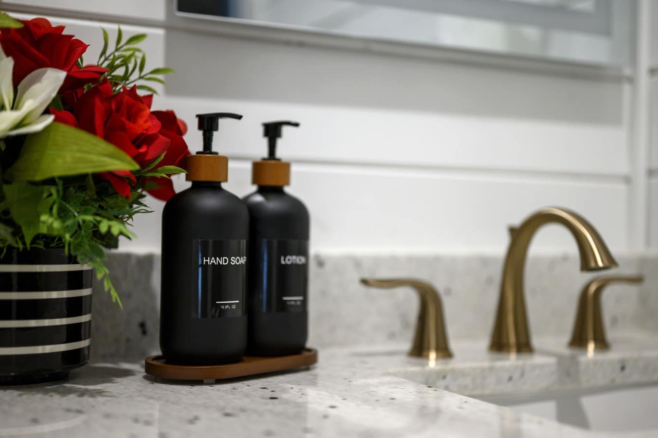 Gold faucets and fresh florals transform your morning routine into a luxury ritual.