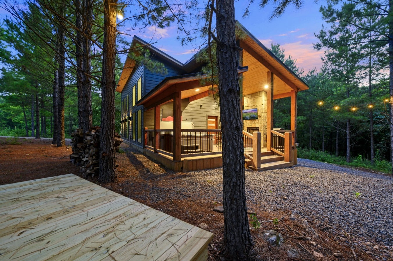 Twilight angle of the cabin and sauna area in the forest.