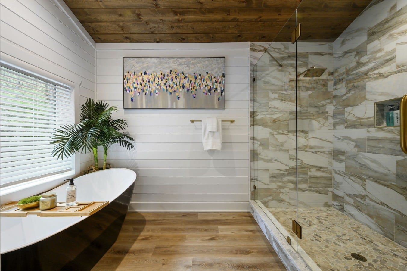 A freestanding soaking tub and marble shower make every bath feel like a spa day.