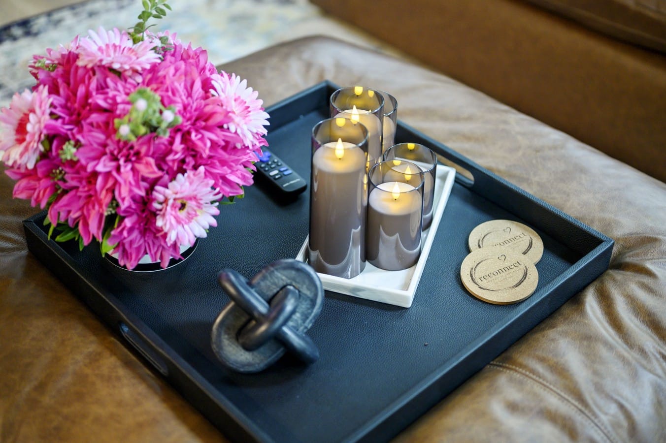 Fresh flowers, candles, and 'Reconnect' coasters — romance is already waiting for you.