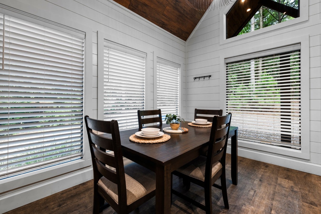 Alternate dining angle beside the windows.