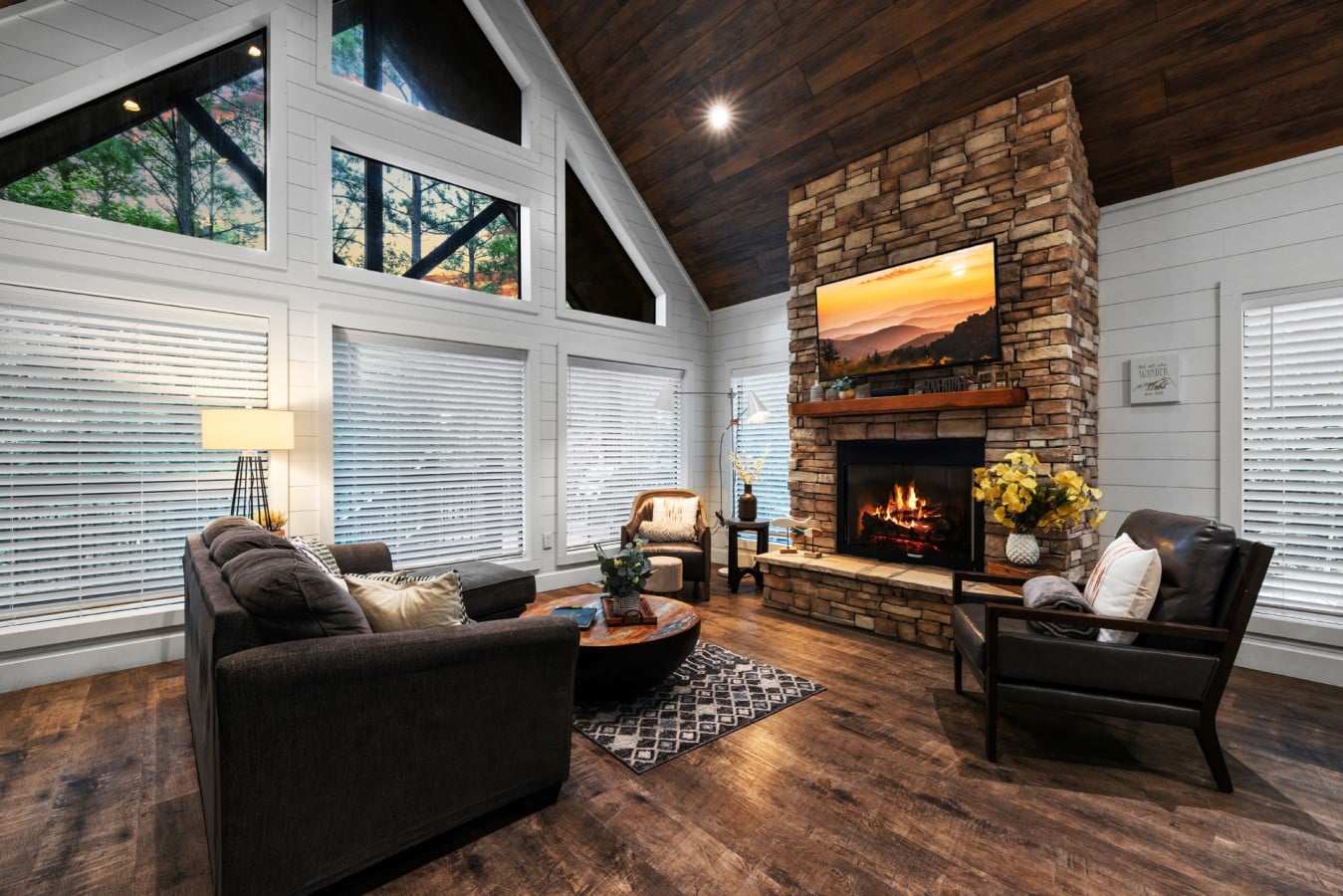 Alternate living room view with sofa seating and fireplace.