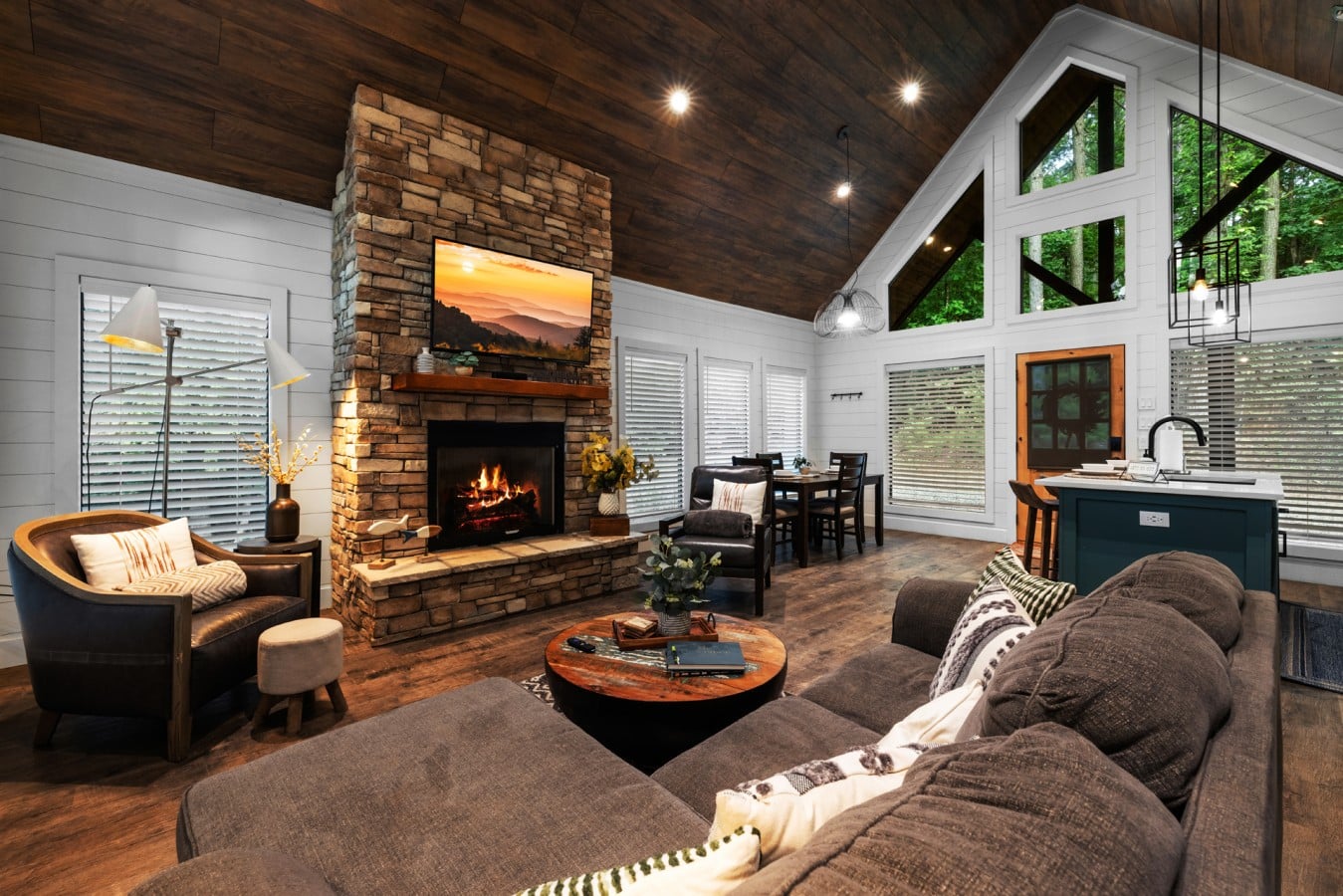Comfortable sofa seating centered around the fireplace and TV.