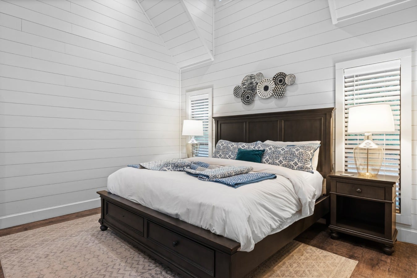 King bed detail with crisp linens and simple Broken Bow styling.
