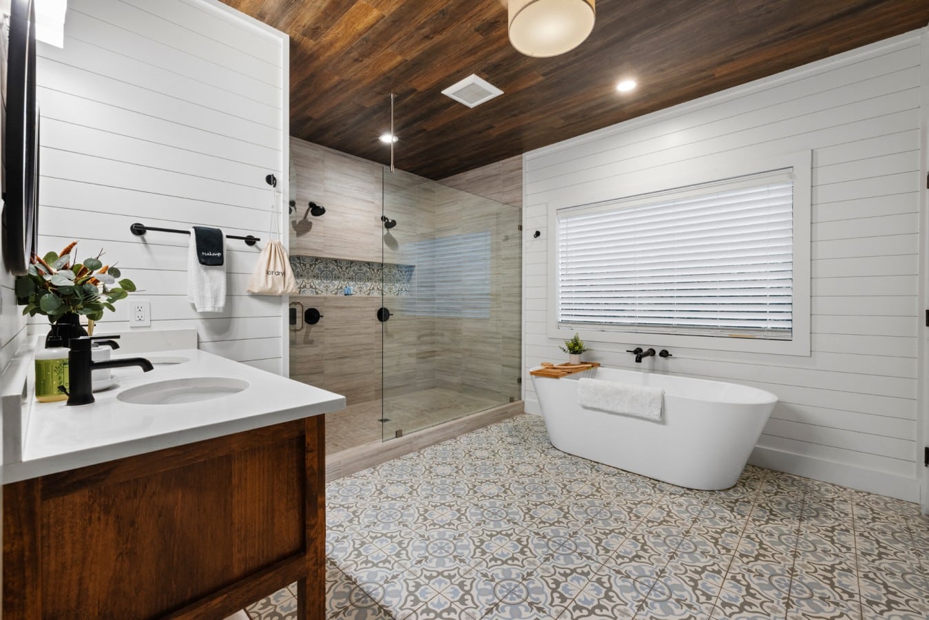Spa-style bathroom with soaking tub, walk-in shower, and double vanity.