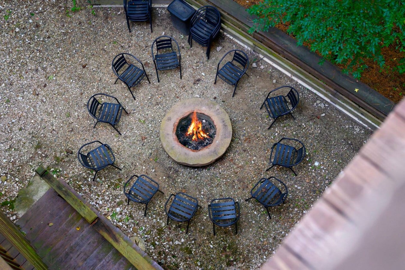 Overhead view of the circular fire pit and Adirondack seating.