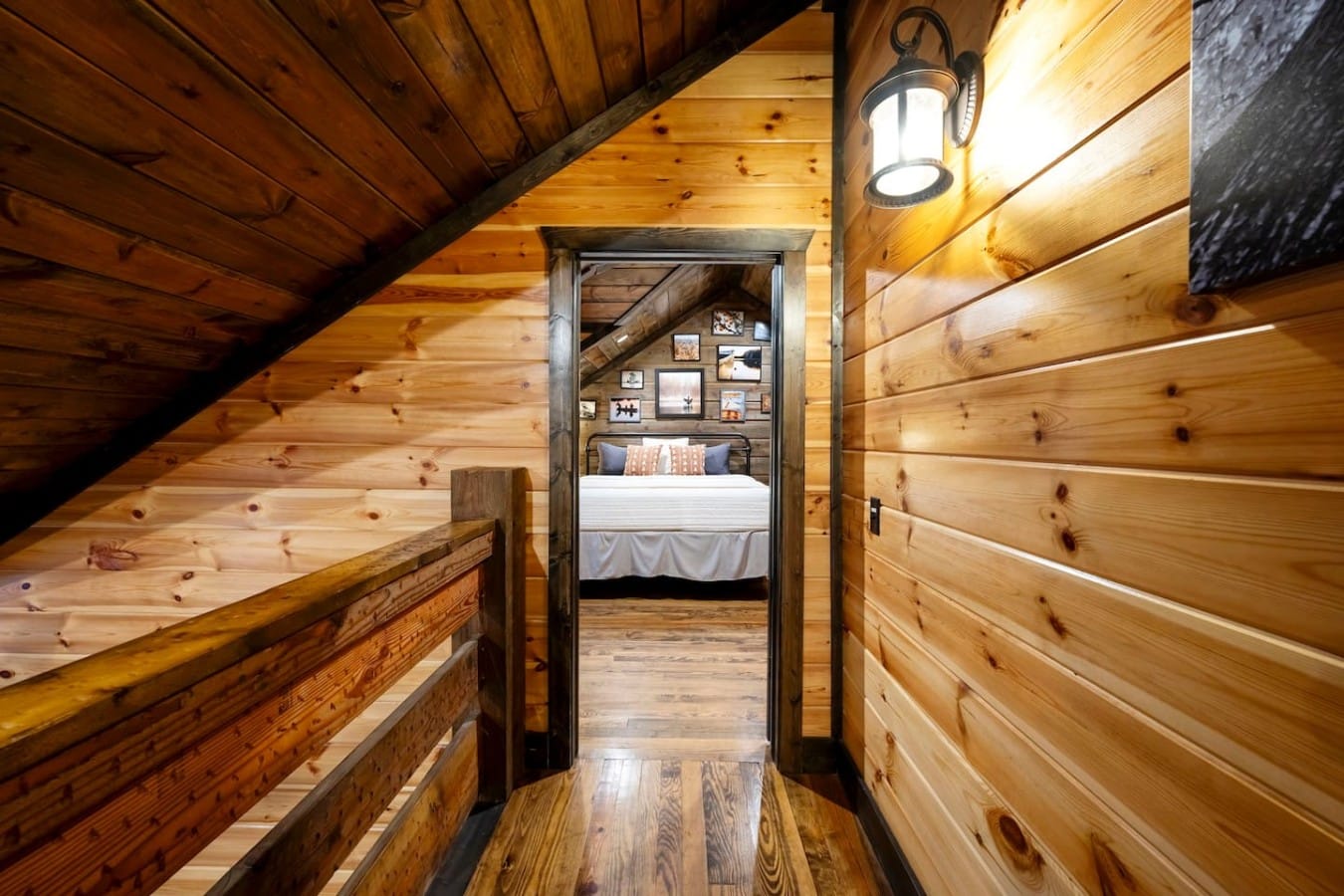 Upstairs hallway view into a guest bedroom.