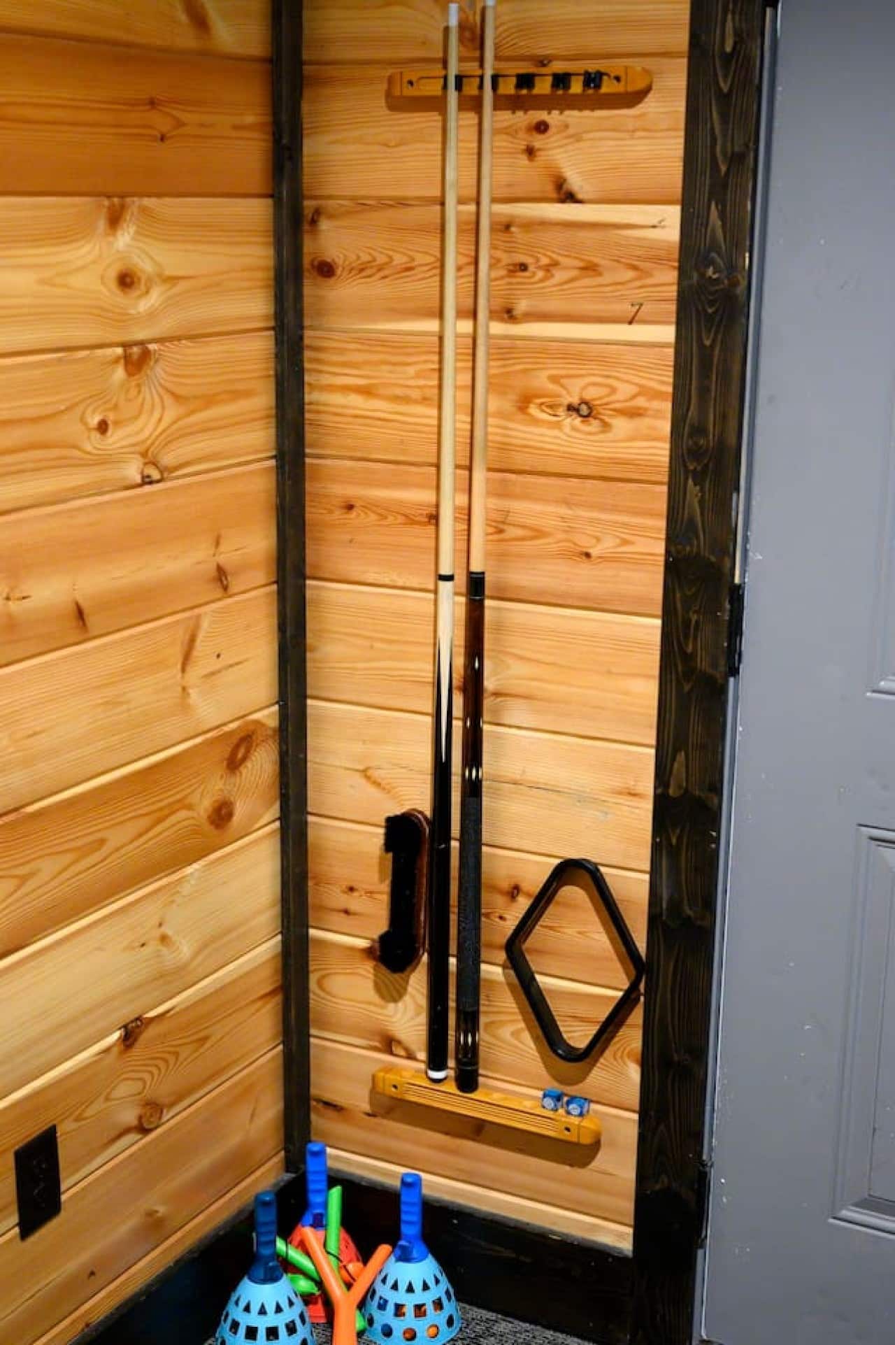 Cleaning tools stored neatly for guest convenience.