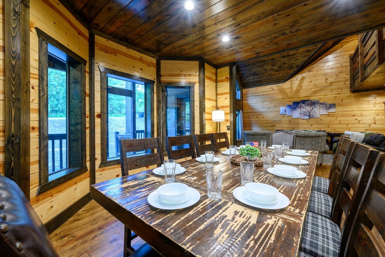 Dining table with wooded views through the deck doors.