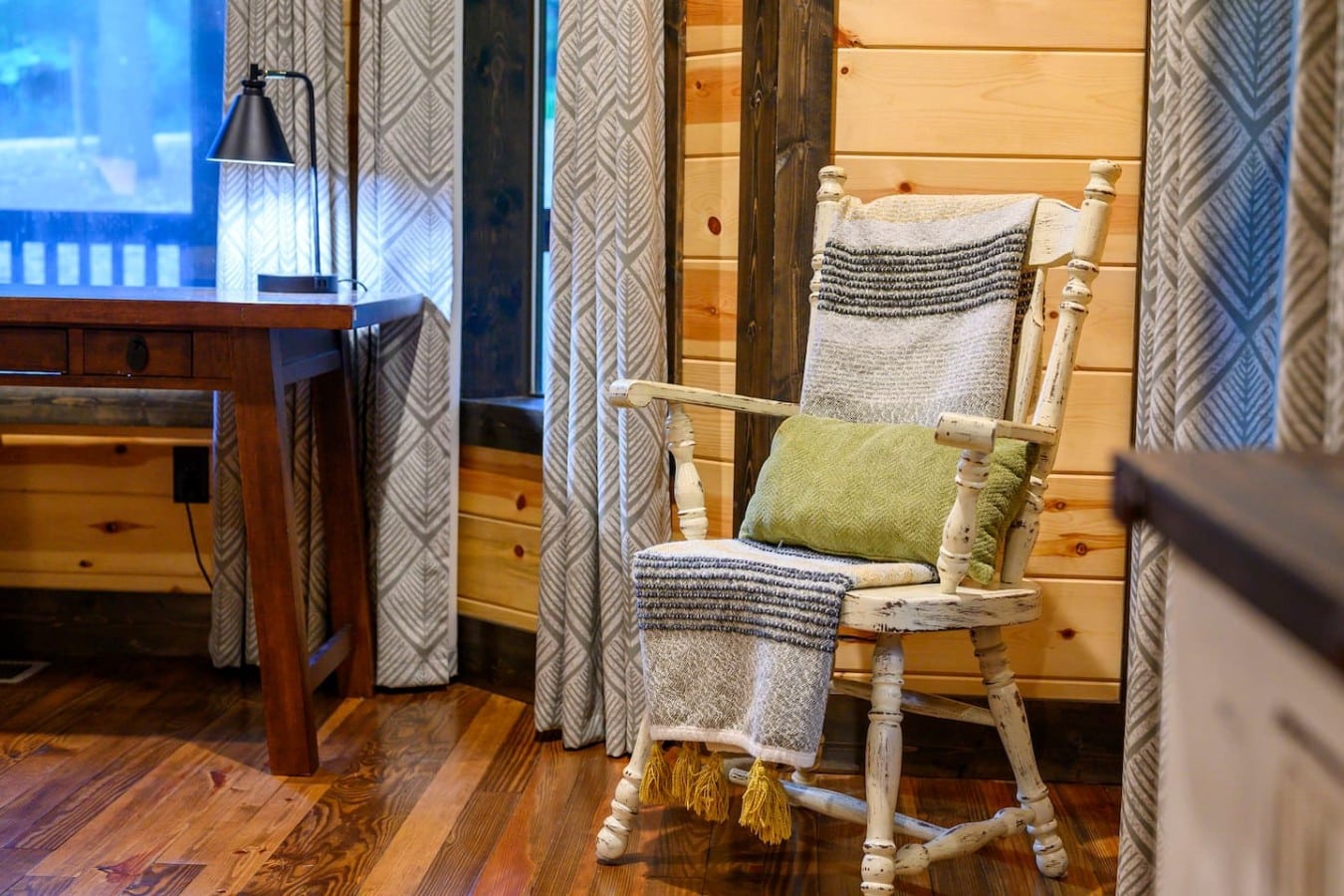 Bedroom sitting chair detail with soft lighting.