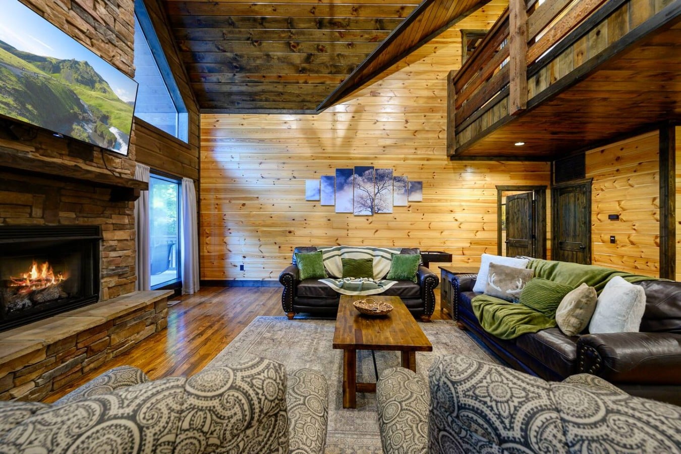 Great room seating centered around the fireplace and window wall.