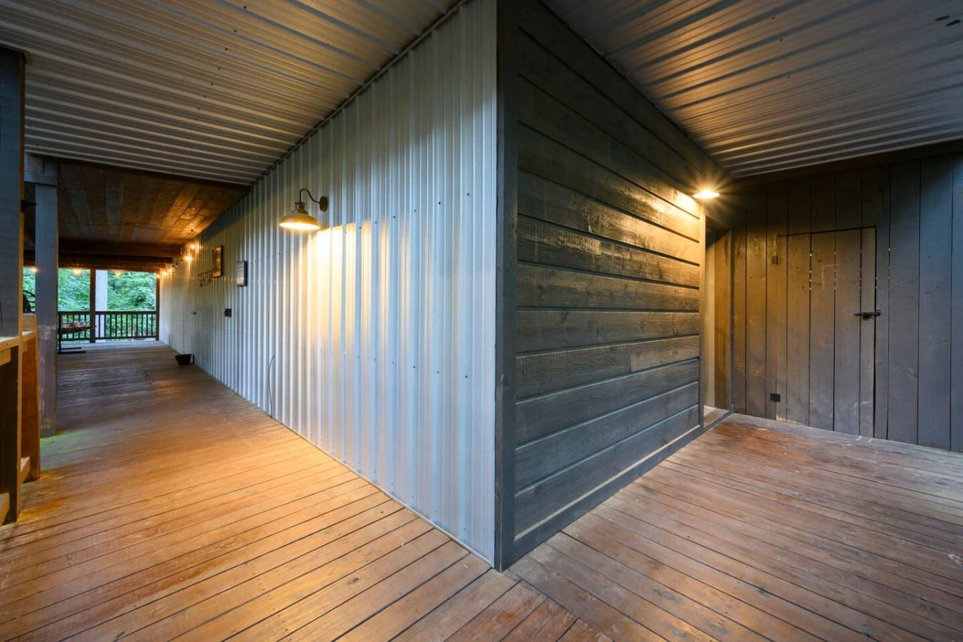 Covered walkway and deck access around the cabin.