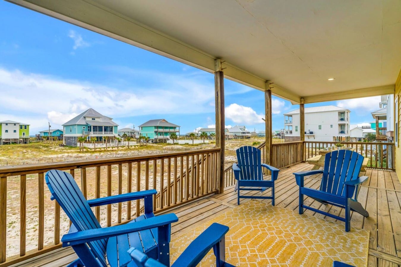 Four Adirondack chairs and a panoramic beach view make this deck your happy place.
