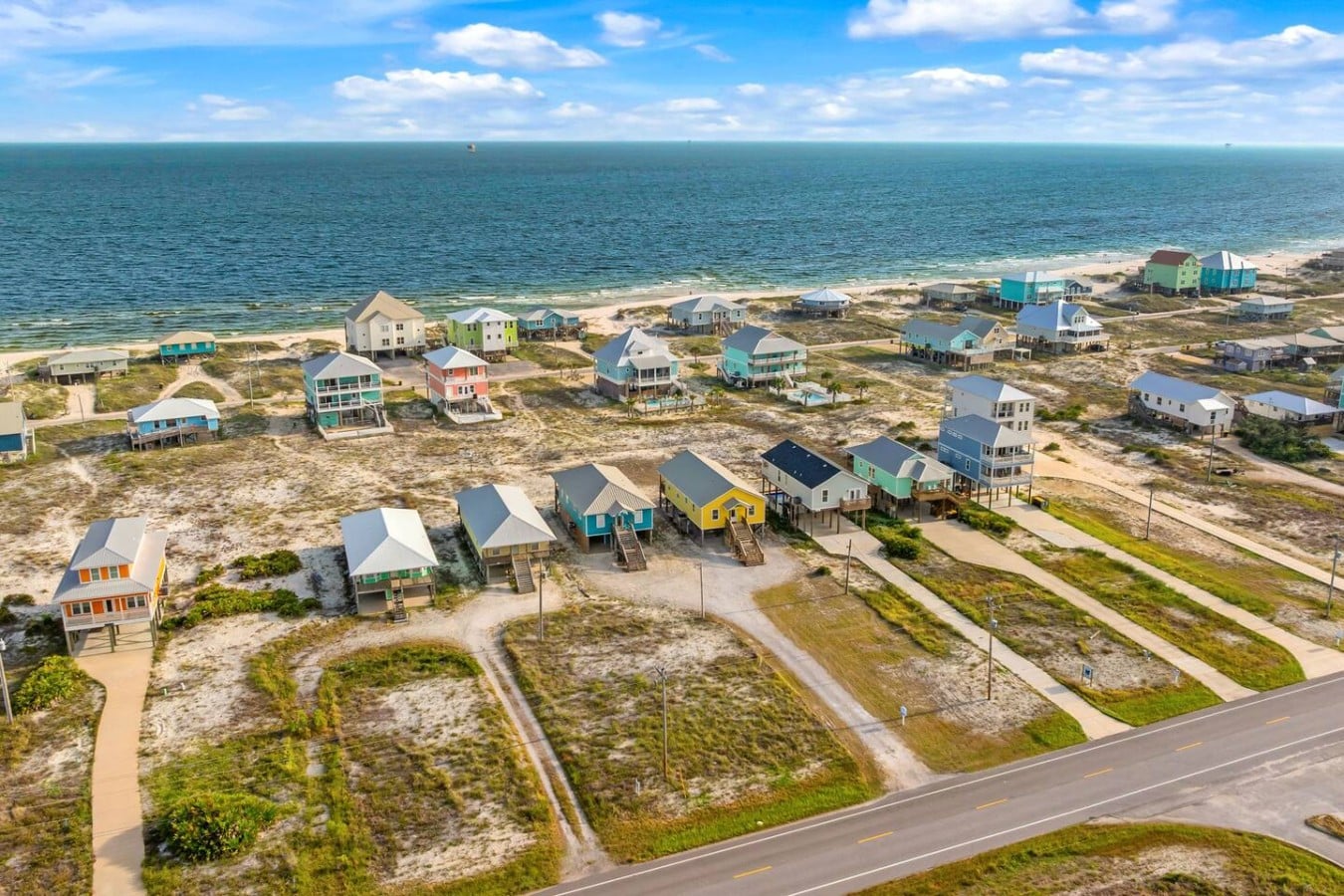 Spot your bright yellow home base from above — Gulf views just steps away.