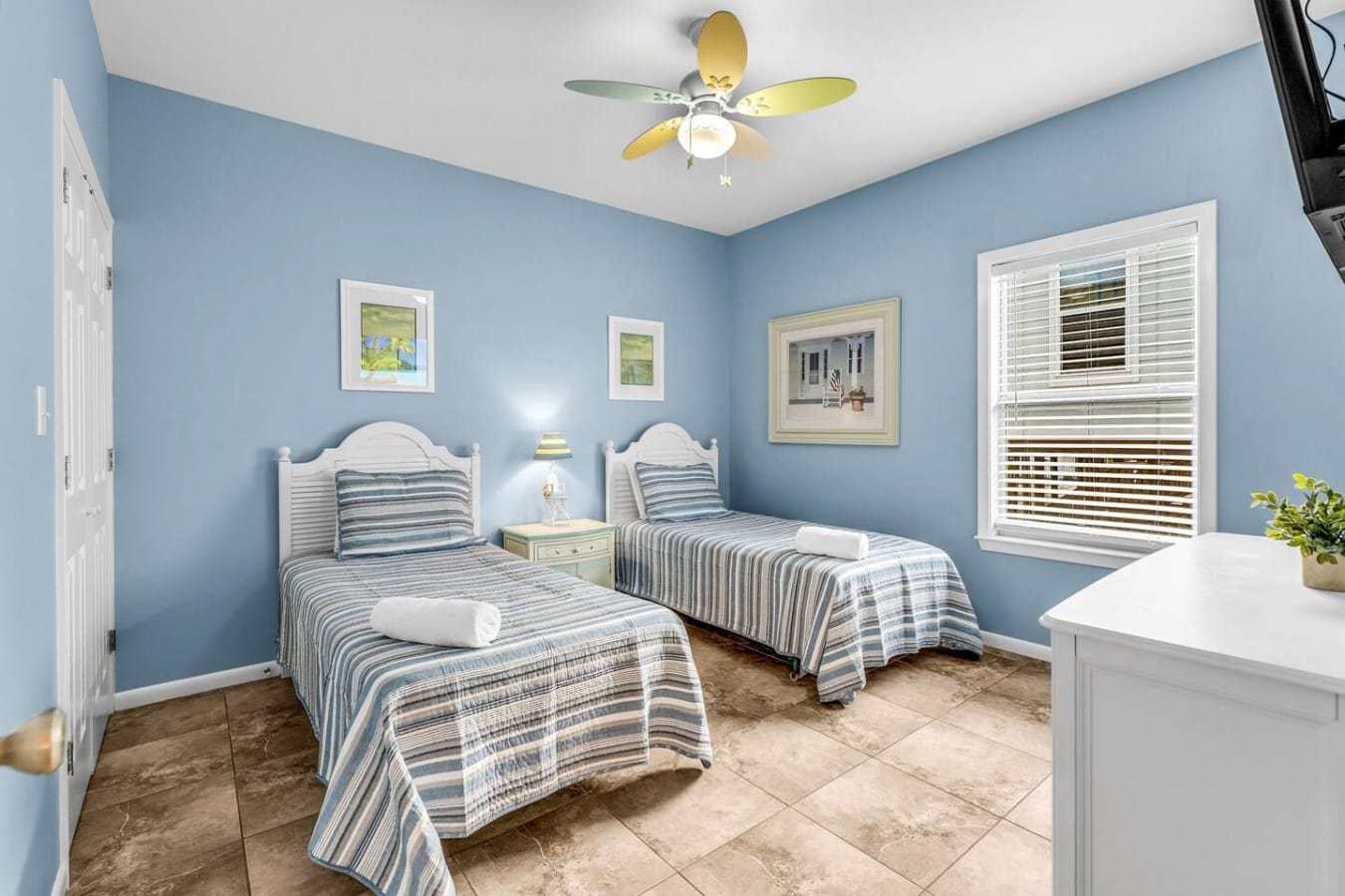 Little ones get their own coastal hideaway complete with twin beds and beach-themed charm.