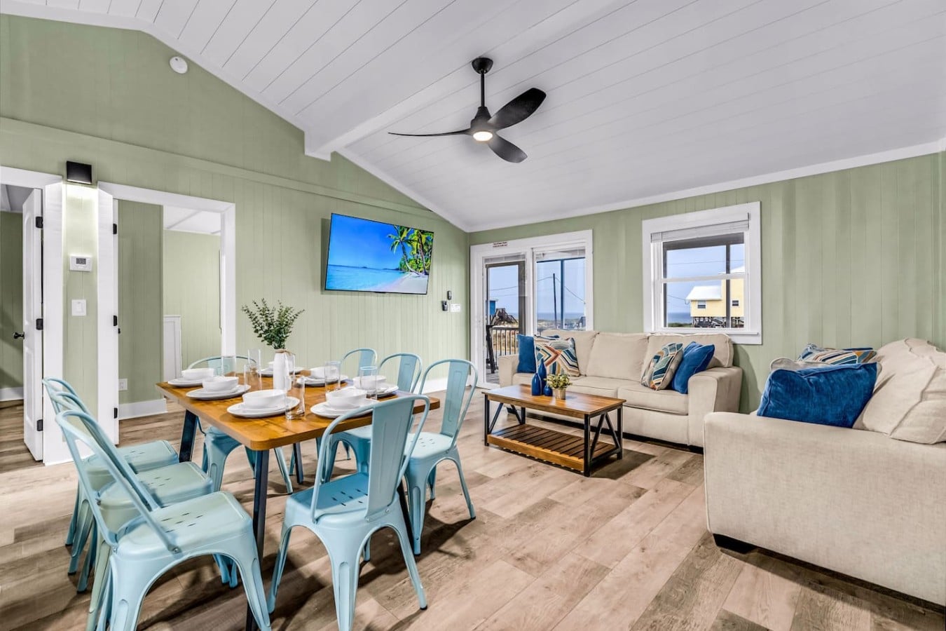 Gather everyone for meals and laughs in this cheerful open-concept dining and living space.