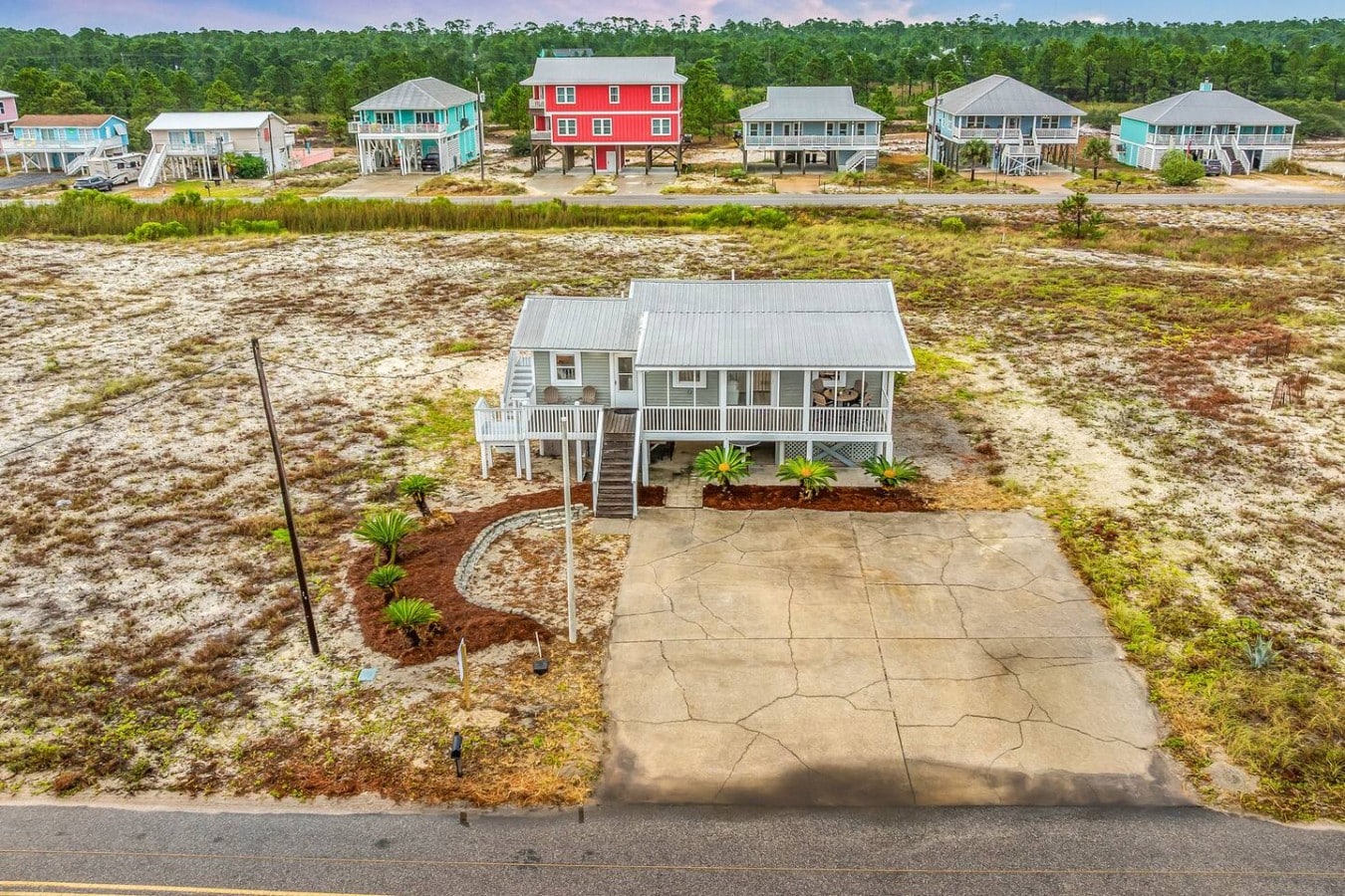 Pull right up to your private paradise on a spacious stamped concrete driveway.