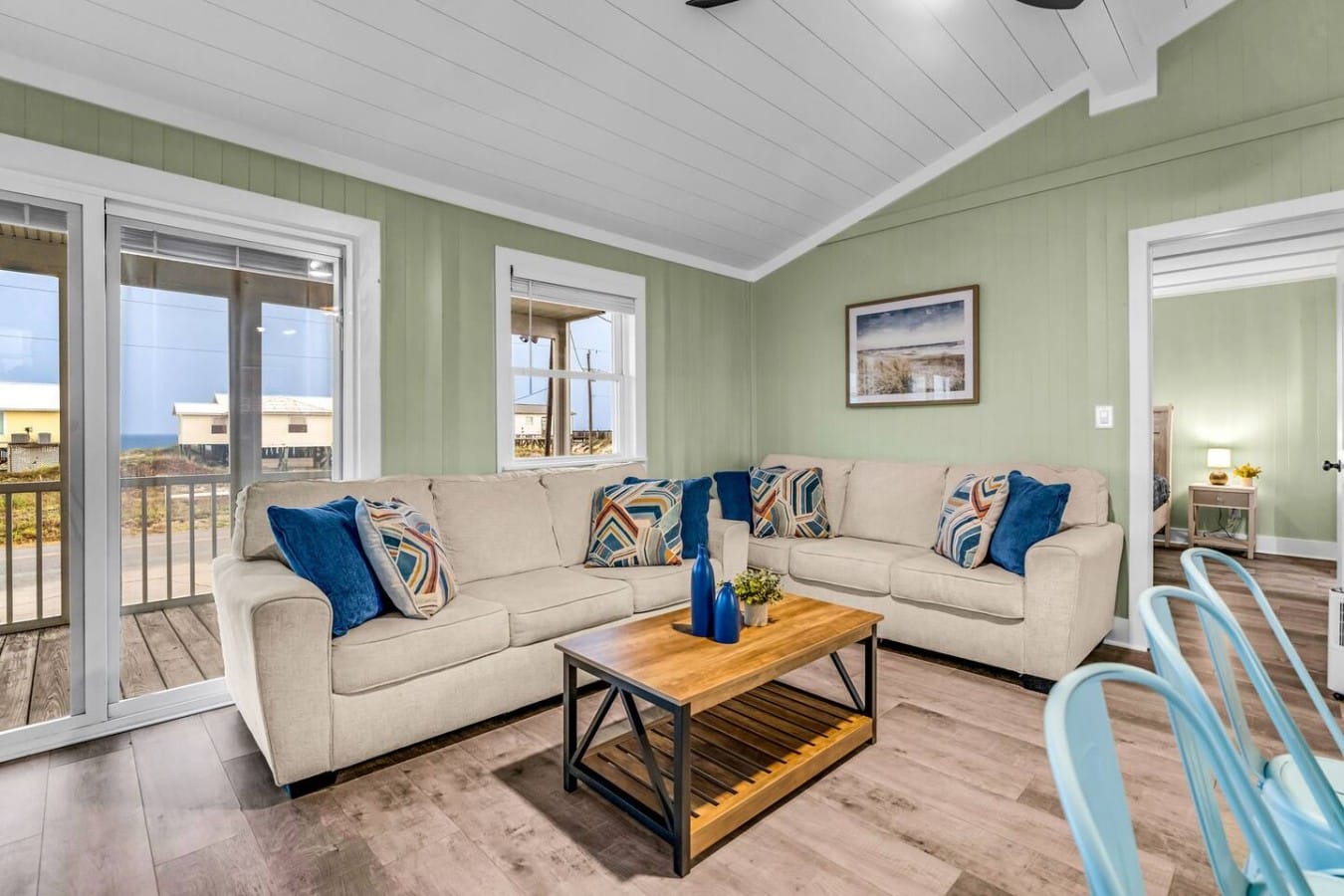 Kick back on plush sofas while ocean views drift through the sliding glass doors.