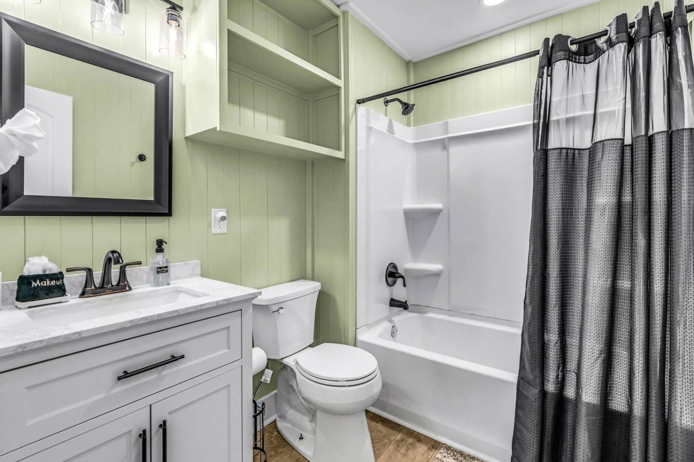 Soak away the day in a full tub-and-shower combo styled with coastal-chic flair.