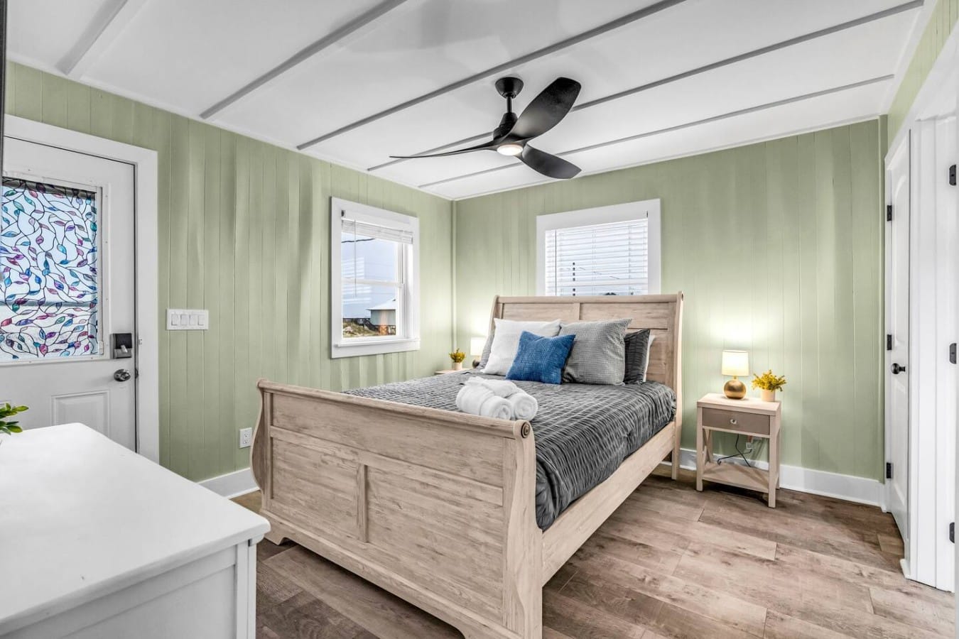 Sunlight and ocean glimpses greet you each morning through the master bedroom windows.