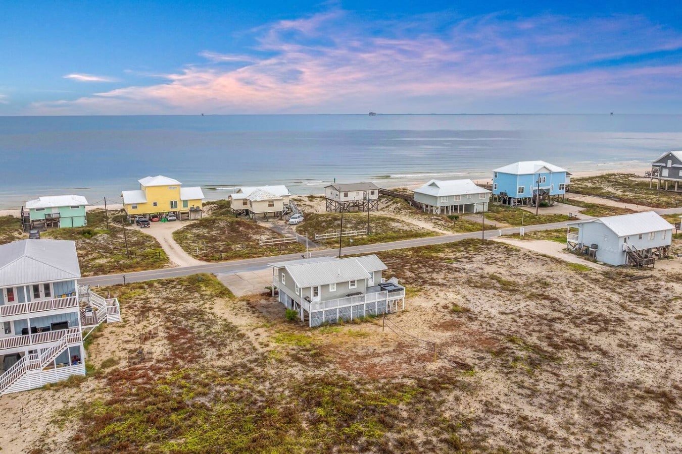 Nestled among colorful beach cottages, your Gulf-steps getaway stands beautifully apart.