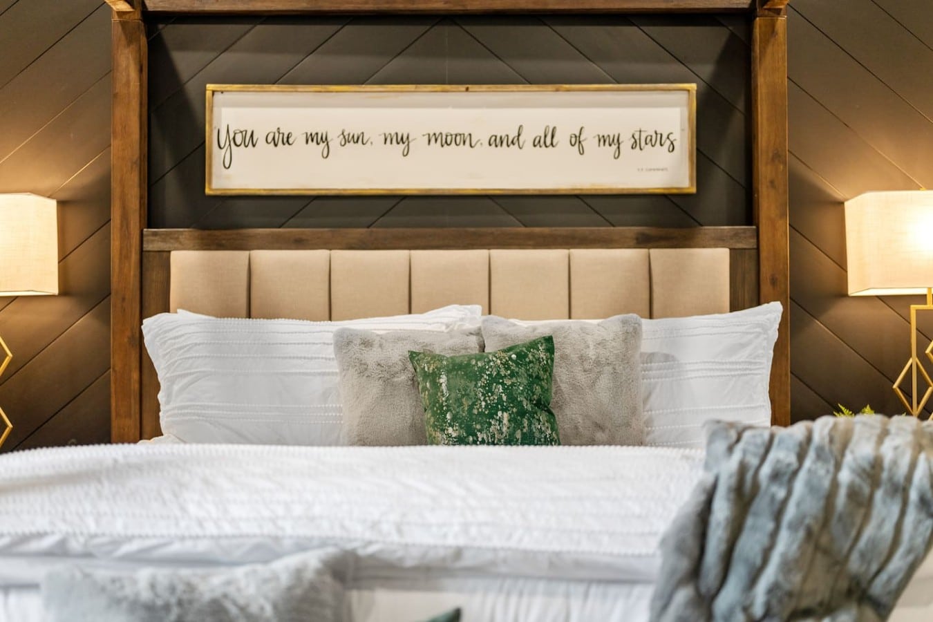 Romance is built into every corner — glowing lamps, a canopy bed, and words that set the mood.