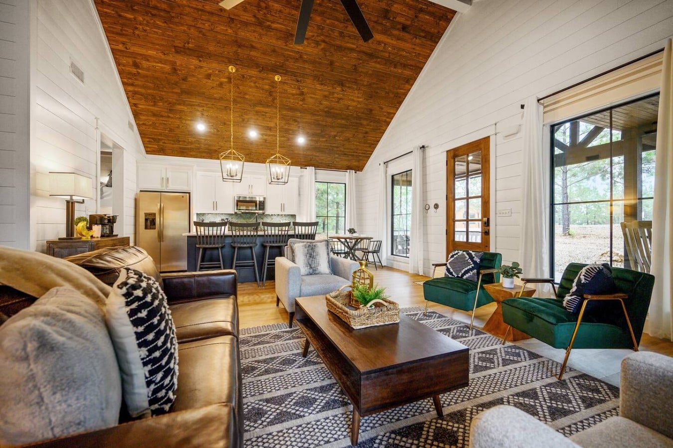 Sink into plush sofas while fresh air flows in through doors that open to the outdoors.
