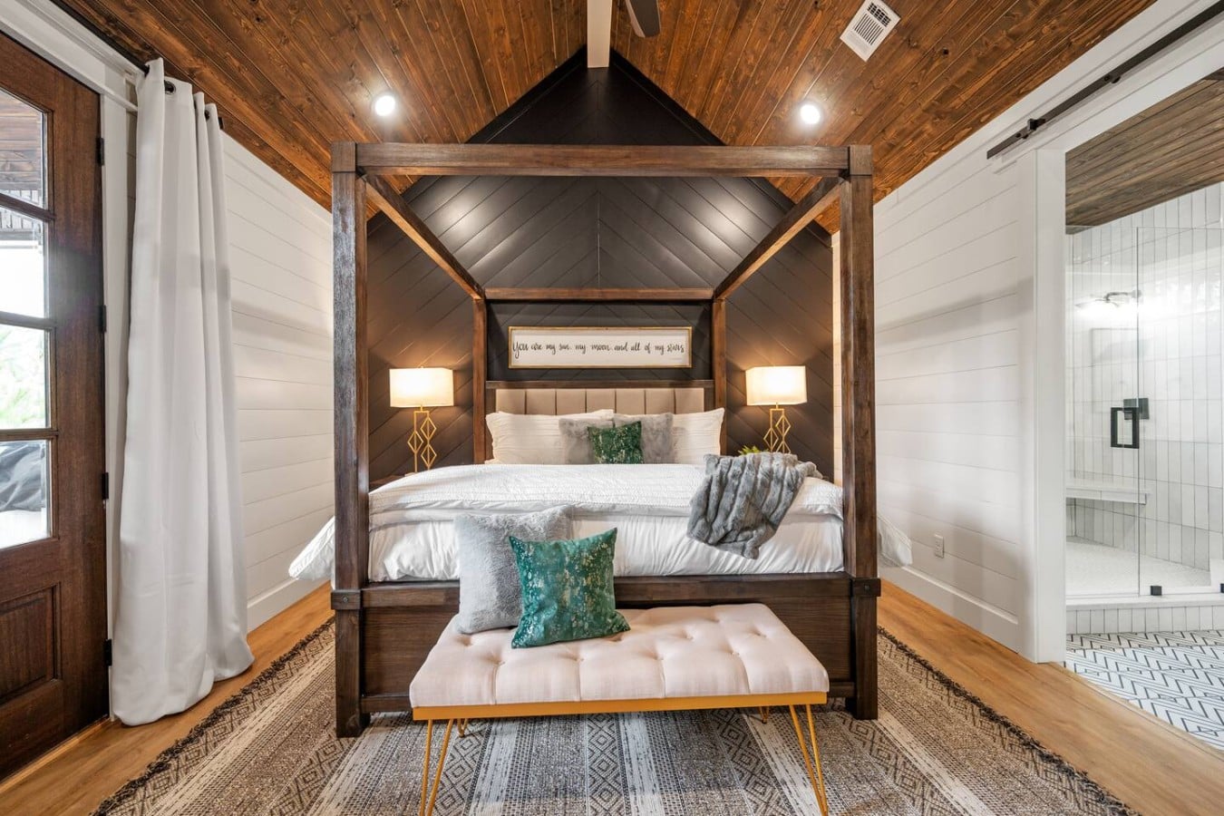 Drift off in a dramatic canopy king bed worthy of a five-star mountain retreat.