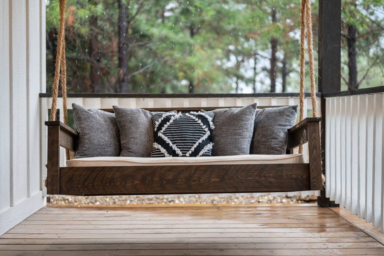 Swing gently on the porch bed as a pine-scented breeze drifts through the trees around you.