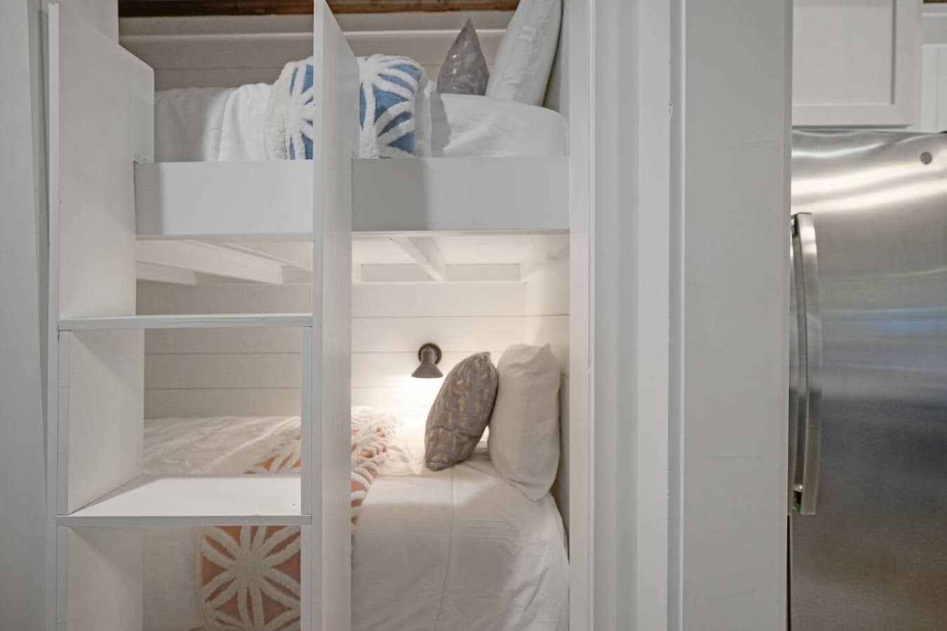 Kids will beg for the bunk beds — each spot has its own cozy light for bedtime reading.