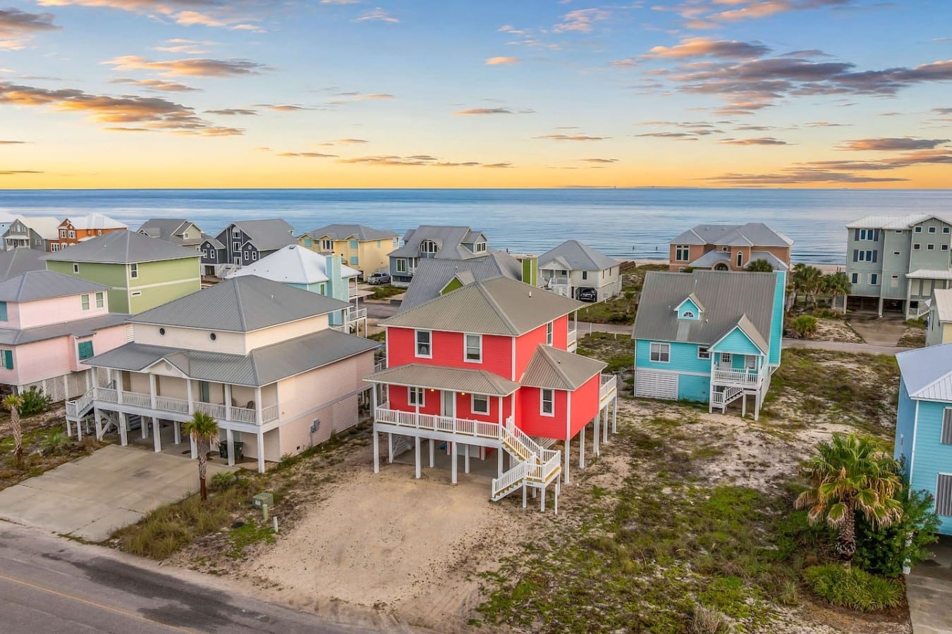 Golden hour never looked better than from above this stunning coral Gulf-front retreat.