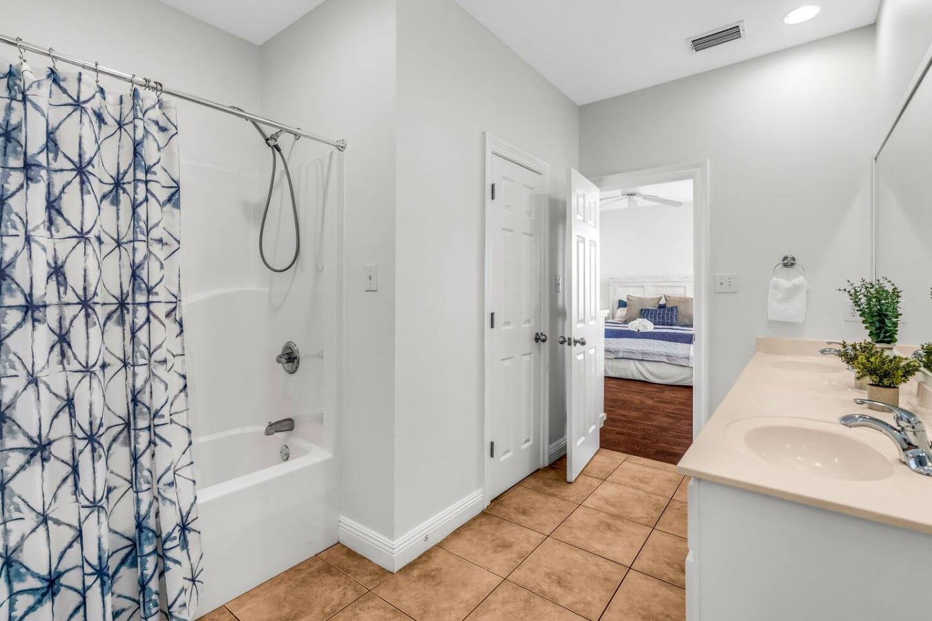 Shared between rooms, this guest bath keeps multi-family stays smooth and comfortable for all.