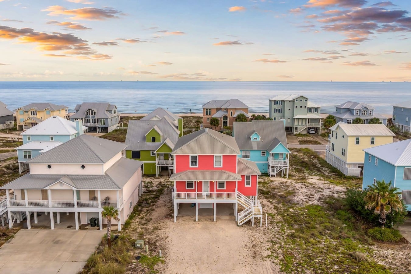 Pull up in style — this iconic coral home is your Gulf getaway front and center.