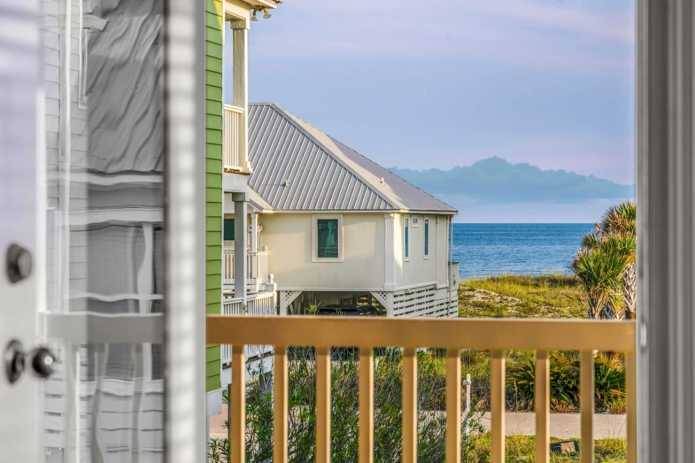 Wake up to sparkling Gulf views framed right through your own balcony door.
