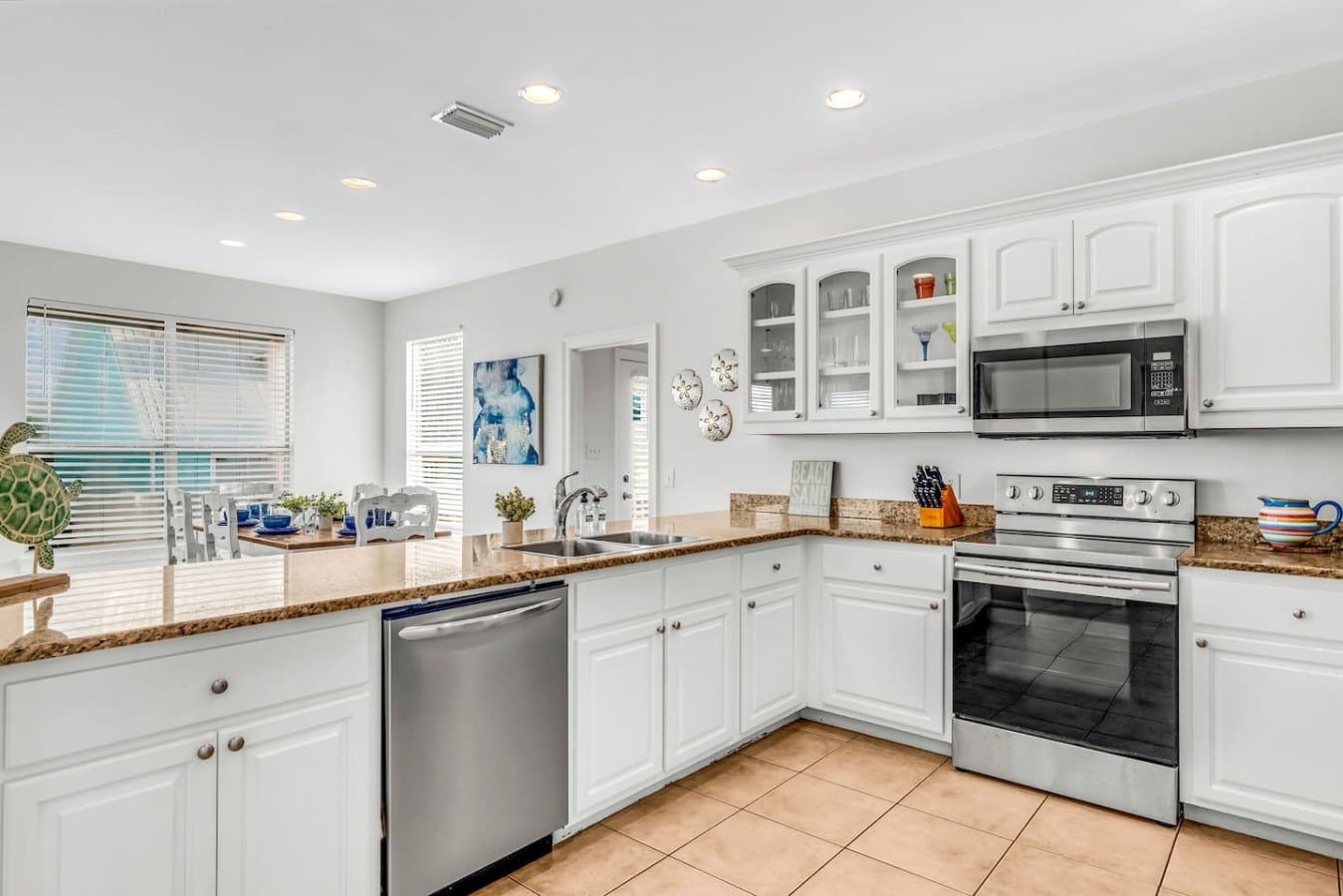 Natural light floods this well-laid-out kitchen, making every meal prep a pleasure.