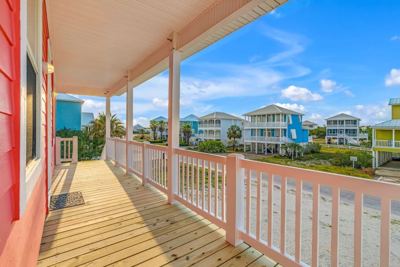 Wrap-around porch life is calling — rock, sip, and soak in the colorful neighborhood views.