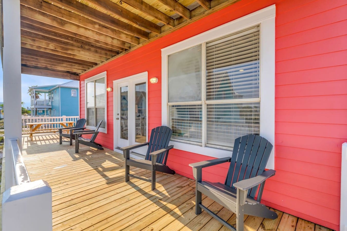 Golden hour on the deck with Adirondack chairs — this is what vacation is supposed to feel like.