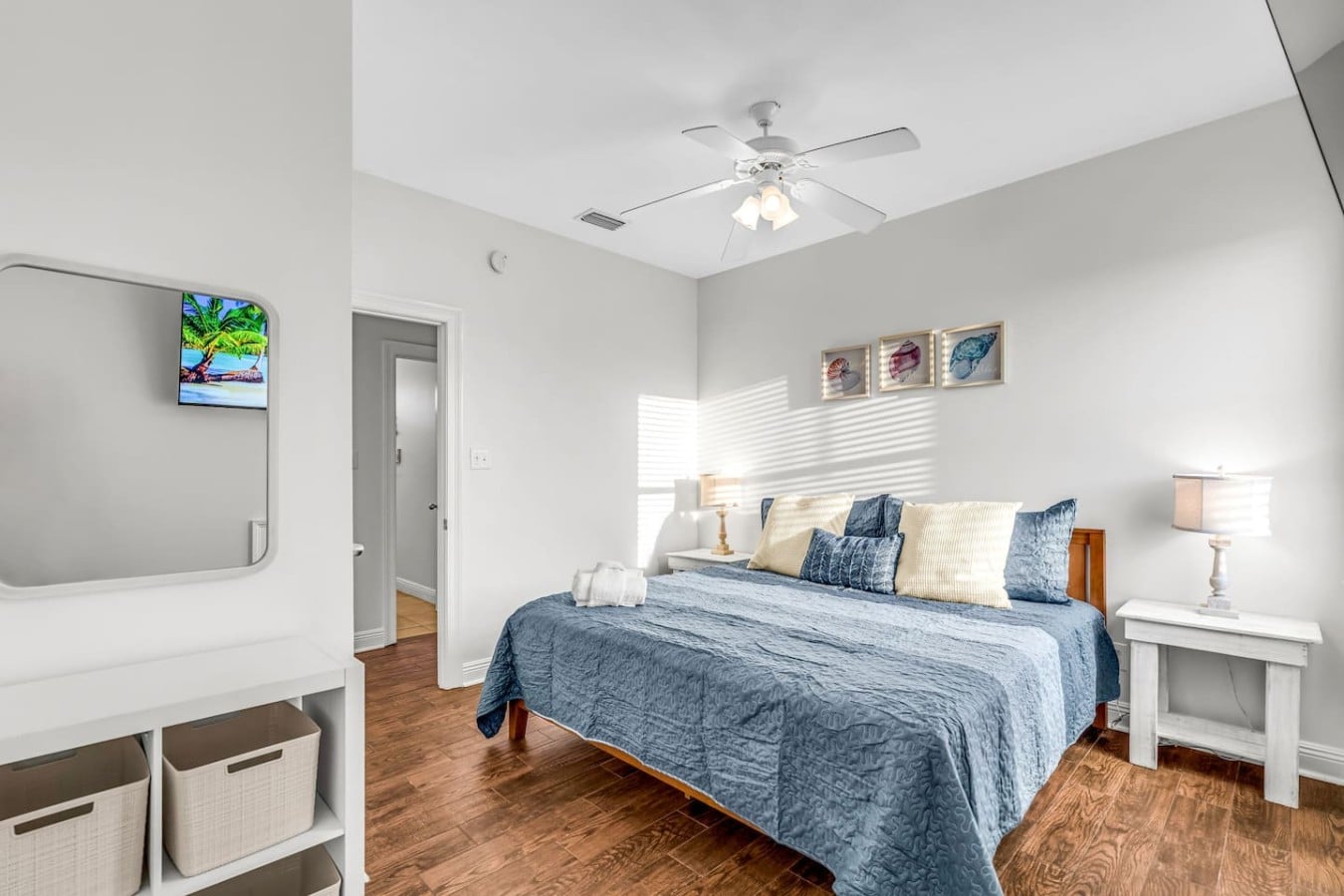 Every guest sleeps well in this cozy blue-themed retreat with its own entertainment setup.