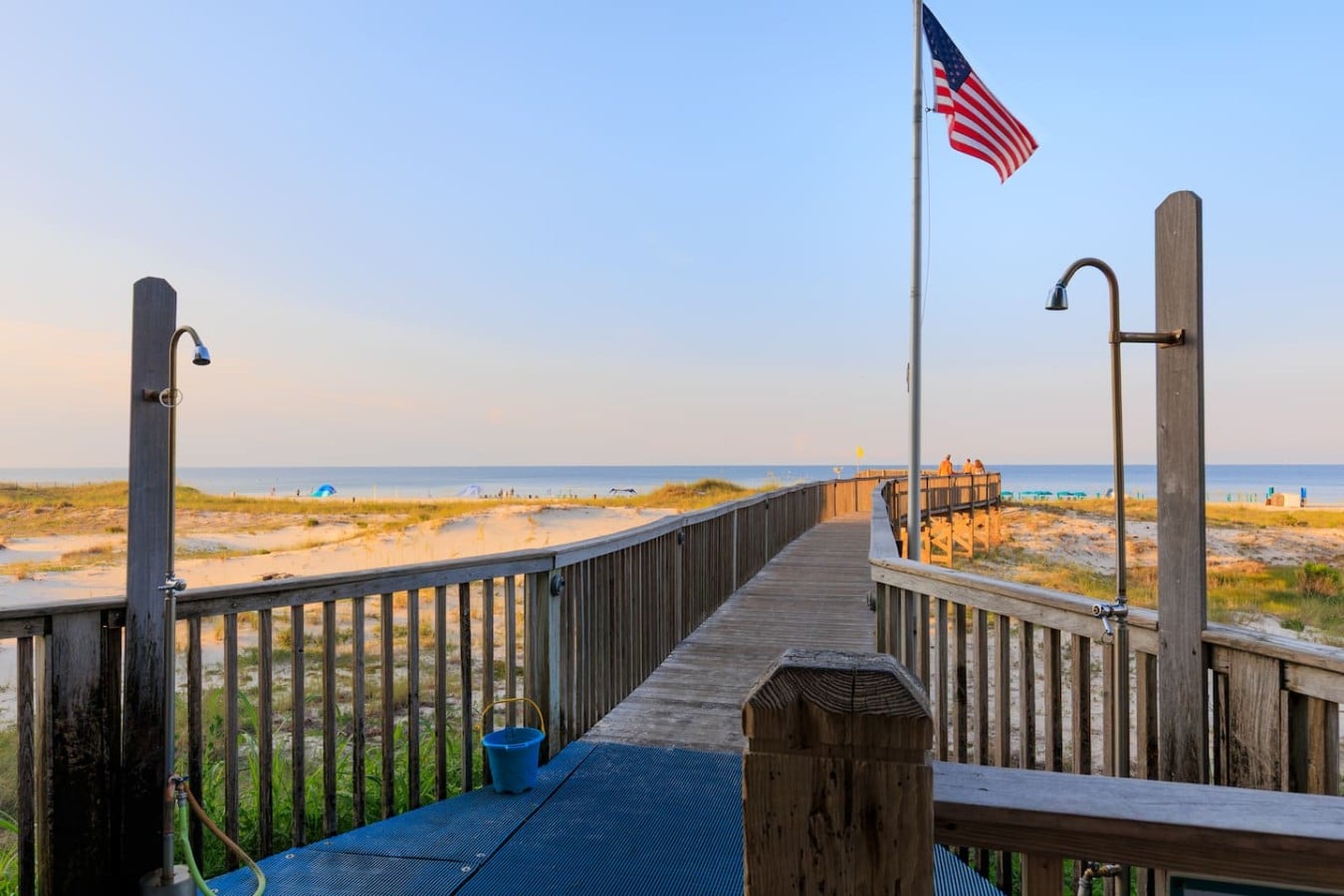 Stroll down a private boardwalk through the dunes straight to white-sand paradise.