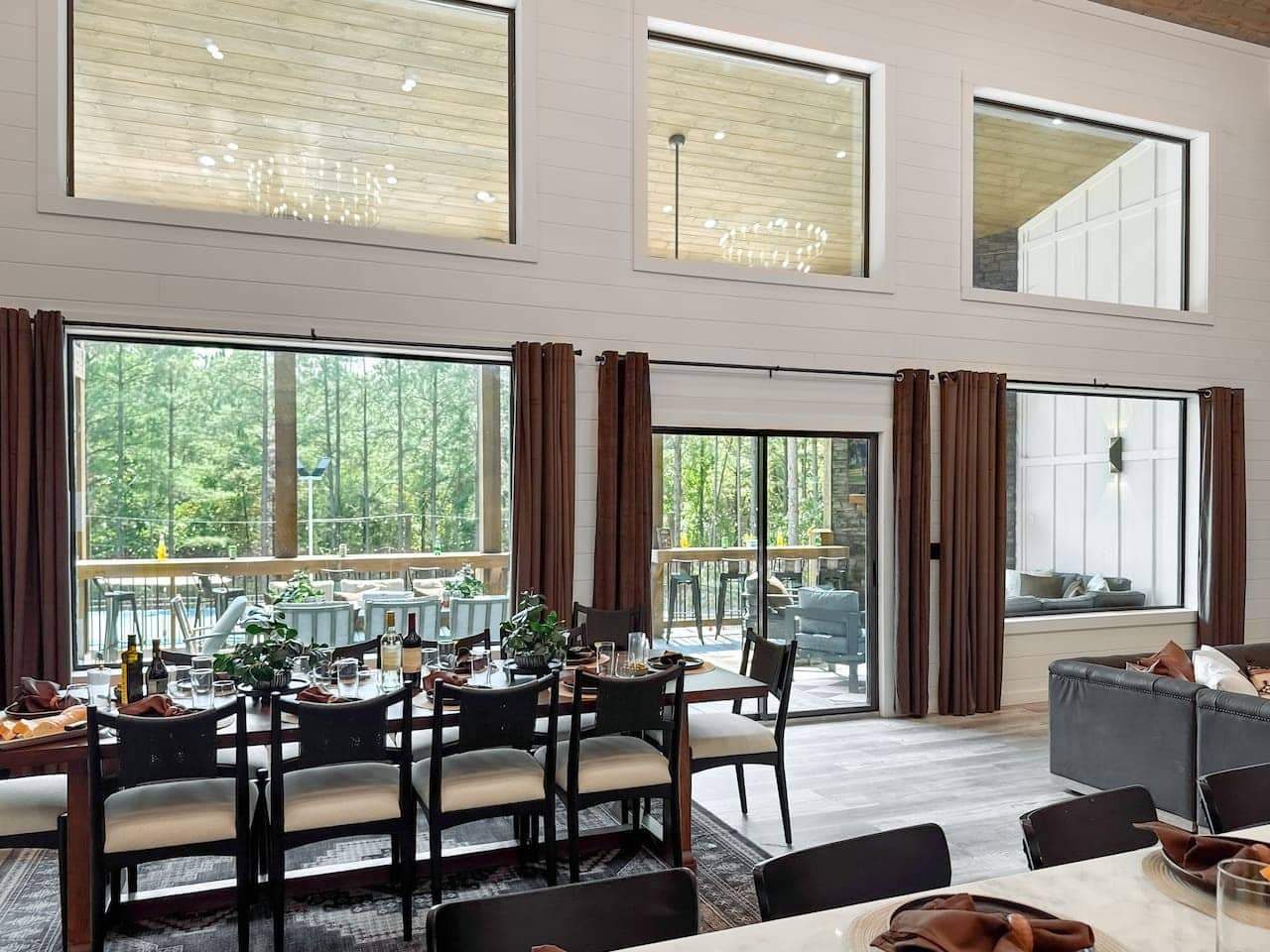 Soak in sweeping forest views from a sunlit dining space made for gathering.