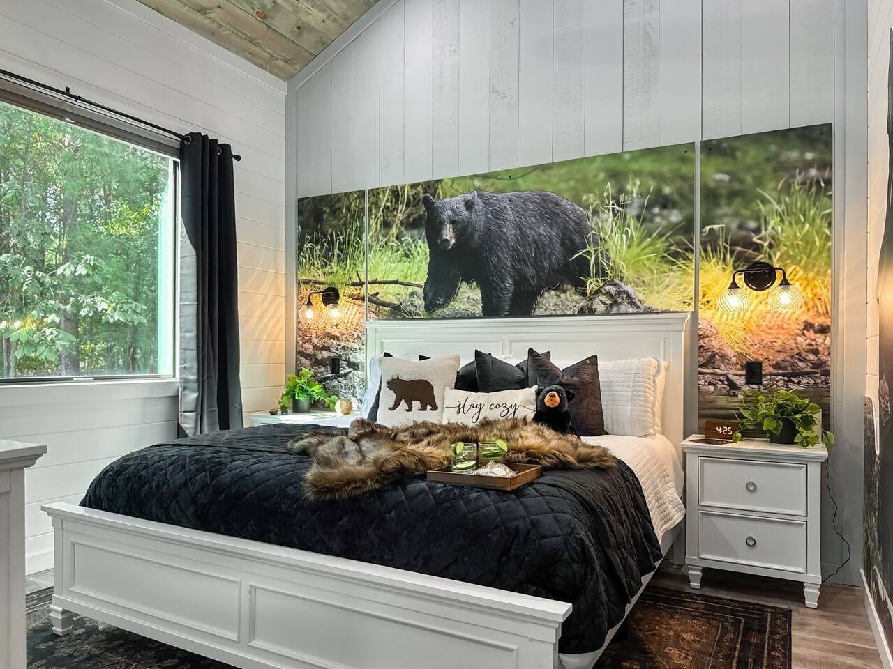 Fall asleep under the watchful gaze of a majestic bear in this wilderness-themed suite.
