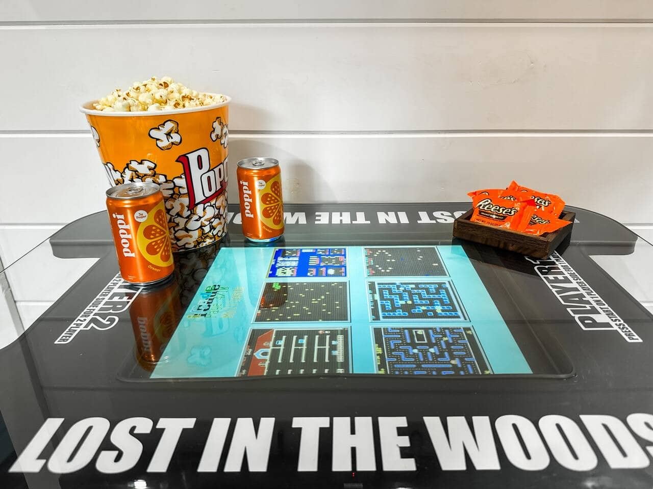 Pop in some popcorn and challenge each other on a custom touchscreen arcade table.