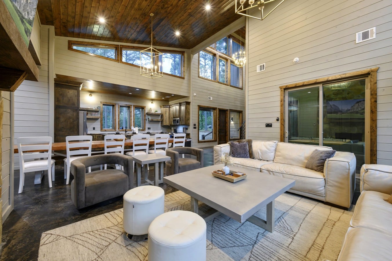 Lounge in a sun-drenched great room with a golf simulator just steps away.