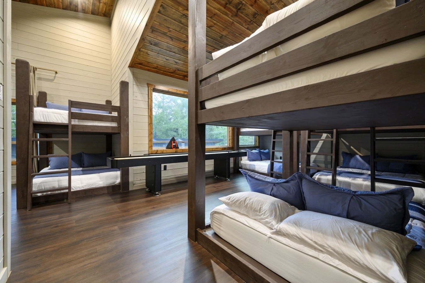 Spacious enough for the whole crew, this bunk room keeps the fun going even at bedtime.